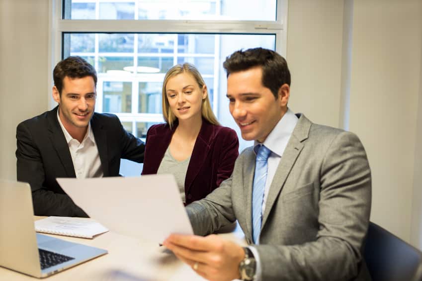 Couple meeting real-estate agent to buy property